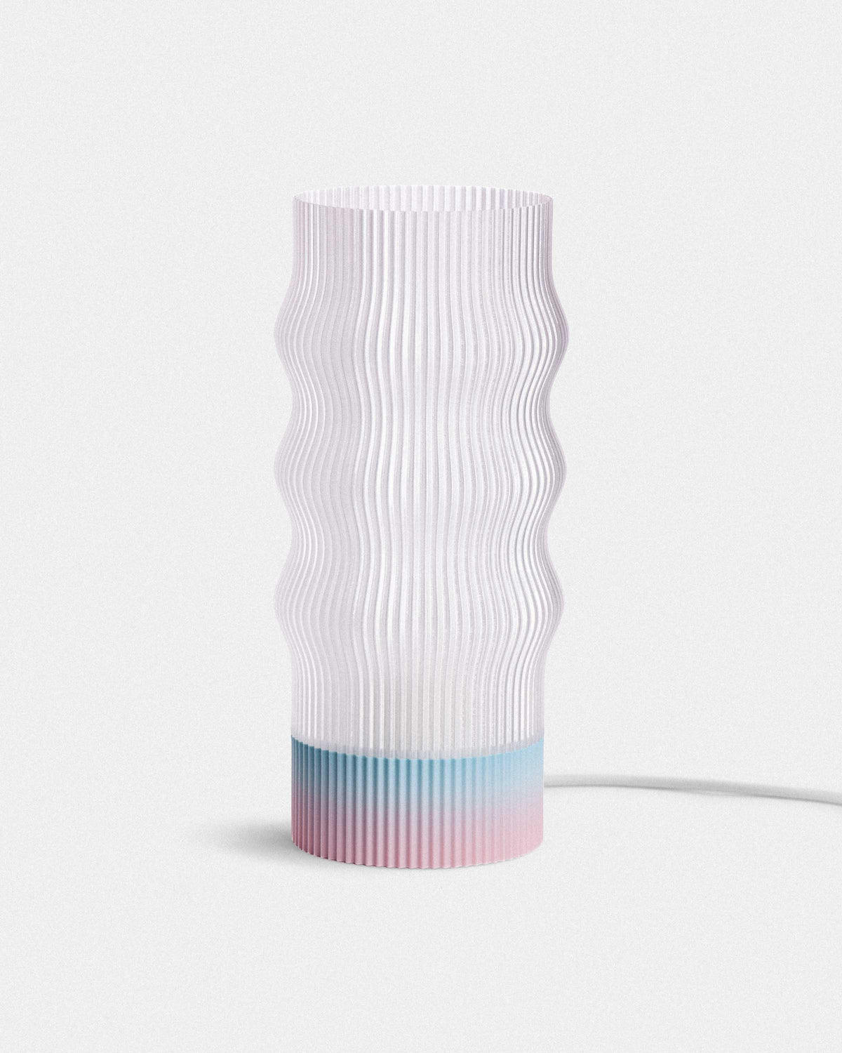 White textured lamp with a gradient blue base on a light gray background