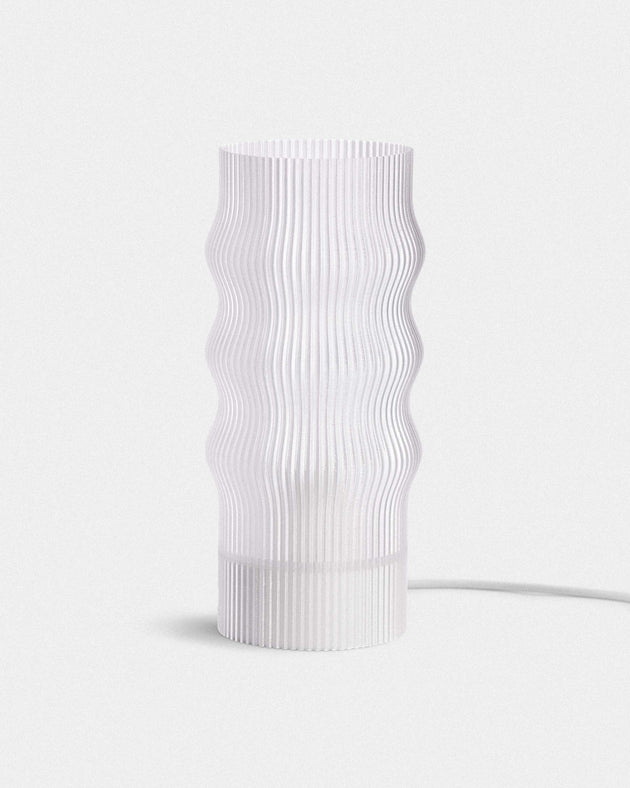 White textured cylindrical lamp on a light gray background