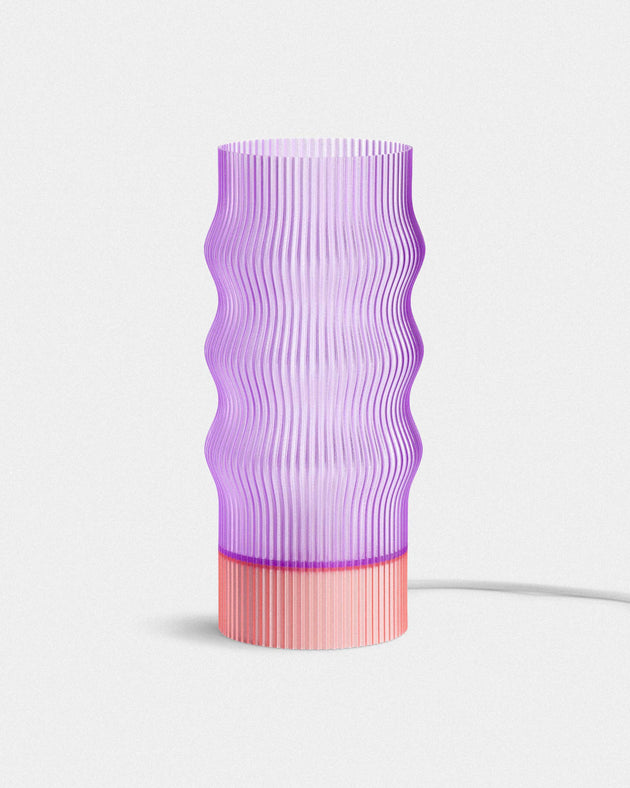 Purple textured table lamp with pink base on a white background