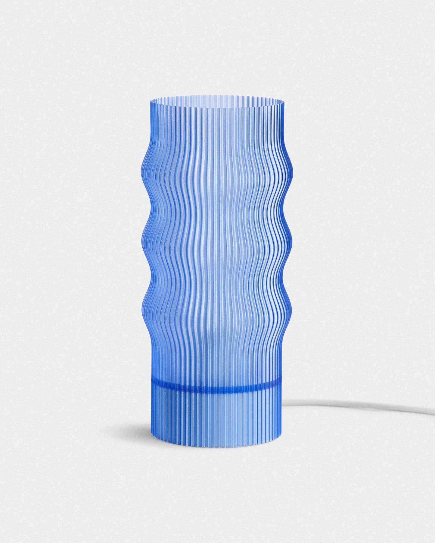 Blue textured lamp on a white background