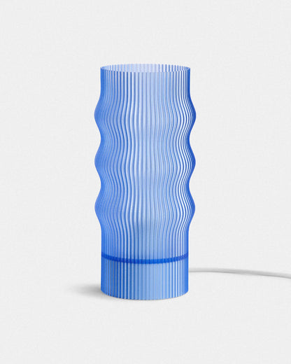 Blue textured lamp on a white background