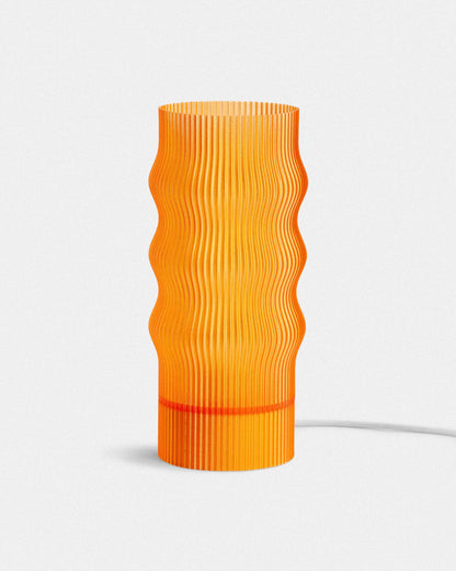 Orange textured table lamp on a white background
